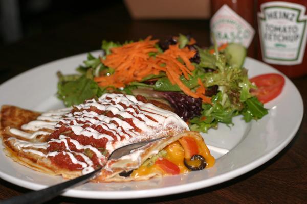 Crepe Escape offers a crepe dish called salsa fresca which is filled with cheddar cheese, olives, avocado, and tomato.: