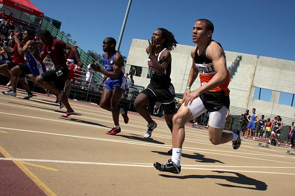 High school track competitors ttake off on the 100 meter dash during the 5th Annual Sacramento State Track Classic held in the Hornet Stadium on Saturday.:Schureman, Shannon