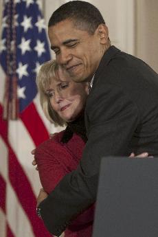 President Barack Obama hugs Lilly Ledbetter at a bill signing ceremony on Jan. 29. :McClatchy Tribune