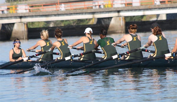 The varsity eight team heads out to the starting line and take first in the third race of the day against Texas and Central Florida on Sunday at the Lake Natoma Invitational - Whitney Truderung: