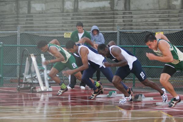 Mens track team starting off running for the hurdles during Friday evenings Causeway Classic Track meet held in the rain at the Hornet Stadium.: