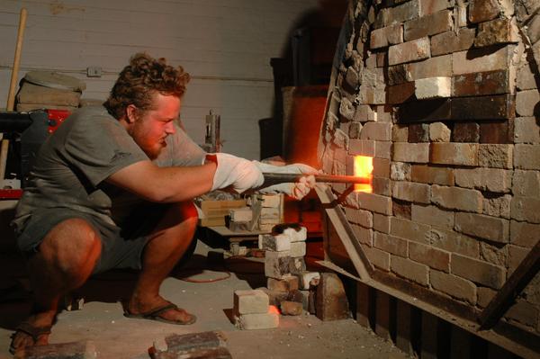 kilns:Paulius Rekasius, senior studio art major, worked past midnight at school on Sept. 15, in order for the ovens to be just the right temperature to salt the ceramics kiln. The oven can get to temperatures as high as 2,200-2,300 degrees Fahrenheit.:Ryan Greenleaf