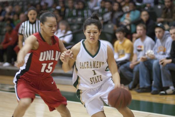 Guard Tika Koshiyama-Diaz (1) drives past a UNLV defender during the game at the Hornets Nest earlier tonight. The Hornets lost to the Rebels 97-92 in overtime.: