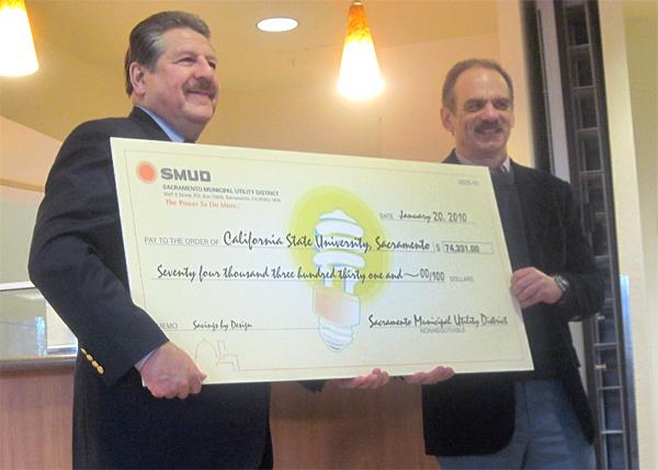Smud check:President Alexander Gonzalez received a $74,000 check from SMUD board member Howard Posner today. SMUD awarded the money to Sac State for the energy efficiency of the American River Courtyard.:Kristine Guerra - State Hornet
