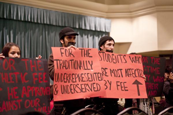 protest, spring address:Sacramento State University students stood up in silent protest during President Gonzalezs spring address.:Mia Matsudaira - State Hornet