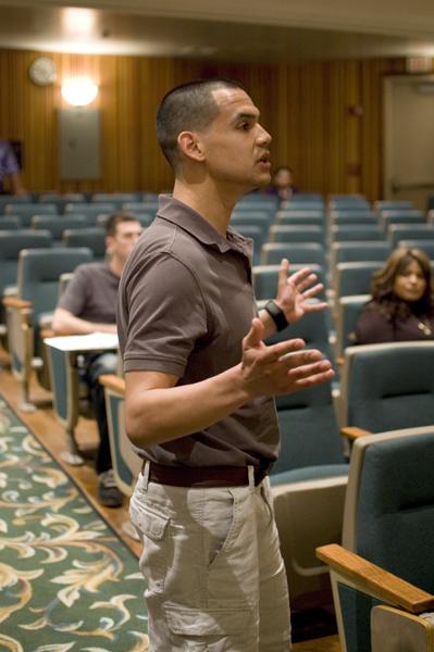 student:Tom Kee, senior economics major, addresses a panel consisting of two assembly members and a professor about budget issues during the Education in the Recession: First things First lecture today in Hinde Auditorium.:Nallelie Vega - State Hornet