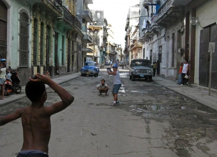 Cuban children playing baseball:Children playing baseball on a street in Havana, Cuba.:McClatchy Tribune
