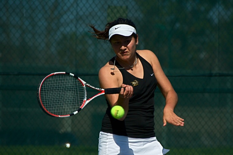 Rebeca Delgado vs. St. Marys:Rebeca Delgado focuses on the tennis ball during a doubles match on Sunday at Rio Del Oro Racquet Club against Saint Marys College.:Tony Nguyen - State Hornet