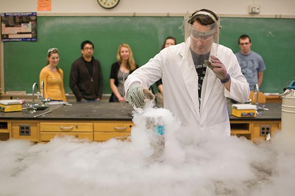 Chemistry Club:Jason Fell, senior chemistry major and president of the Chemistry Club, demonstrates what happens when boiling water and freezing liquid nitrogen are combined.:Robert Linggi - State Hornet