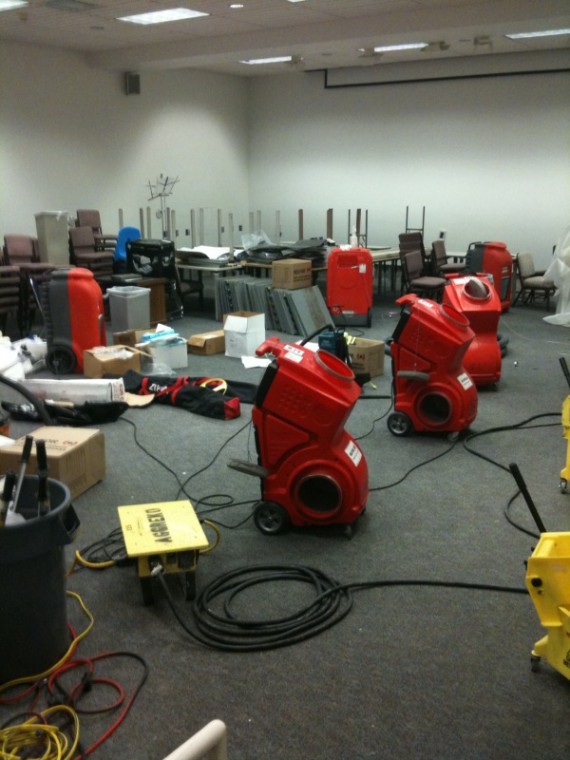 flooding:At least six dehumidifiers were placed inside Room 11, located in the lower level of the Library. Room 11 had more than 4 inches of standing water because of the flooding on Tuesday.:Kristine Guerra - State Hornet