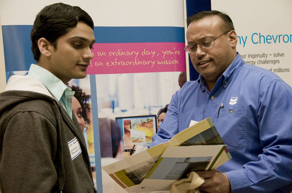 engineering:A student and employer discuss jobs at the engineering Career Day in 2009. :Courtesy Photo