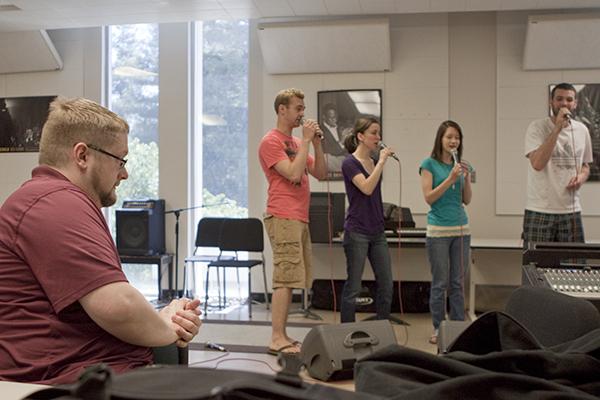 jazzvocal:Vocal jazz director Kerry Marsh coaches students during rehearsal Friday in Capistrano Hall. :Robert Linggi - State Hornet