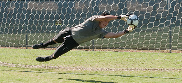 freshmangoaliesoccer:Freshman goalie Cesar Castillo for the Sac State men?s soccer team blocks the ball before it enters the goal. :Rachel Lotz - State Hornet