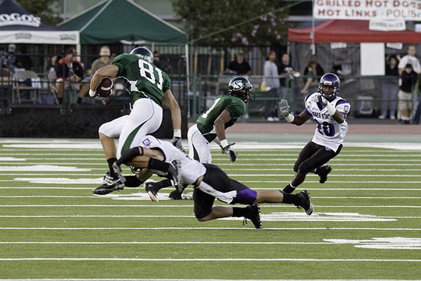 Deadder vs. Weber State:Wide reciever Chase Deadder jumps to avoid being tackled during a game against Weber State on Saturday night at Hornet Field. The Hornets won 24-17.:Robert Linggi - State Hornet