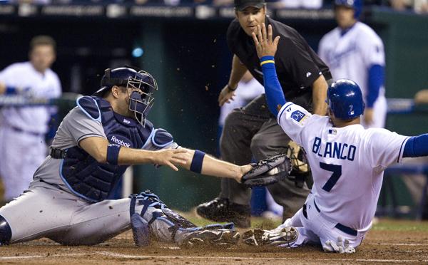 Double Coverage baseball:Kansas City Royals Gregor Blanco (7) scores as Tampa Bay Rays catcher Kelly Shoppach (10) tries to reach him with the tag in the first inning at Kauffman Stadium in Kansas City, Mo., on Friday.:John Sleezer/Kansas City Star - MCT