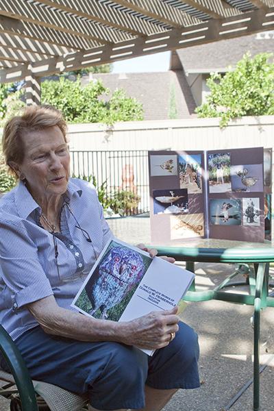 herberholz1:Barbara Herberholz chats about her husband as she shares a book and photos of his artwork at her Gold River home on Monday.:Robert Linggi - State Hornet