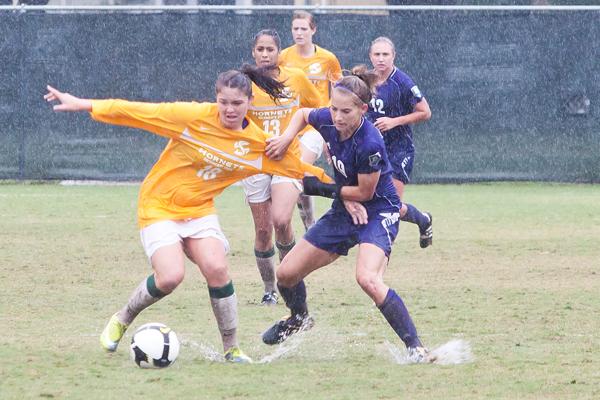 Sacramento State womens soccer earns fourth Big Sky win:Hornets forward Kelsey ODonnell struggles for the ball with Weber States midfield Collette Simmons during Sundays rainy game at Hornet Field.:Ashley Neal - State Hornet 