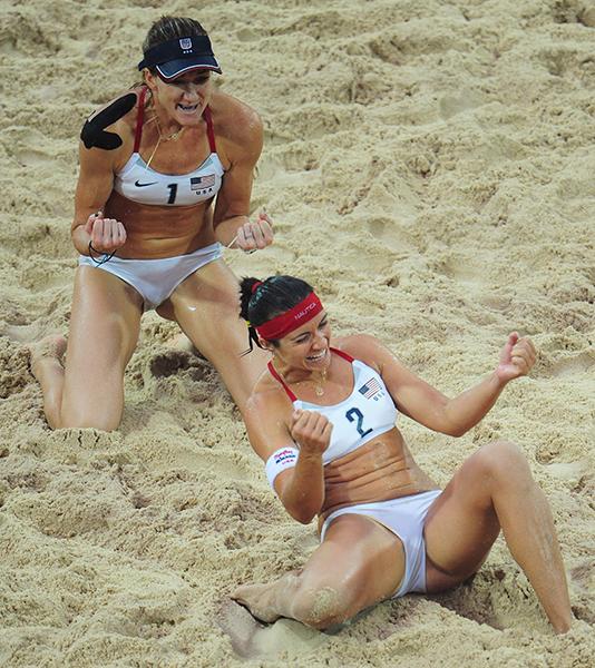 doublecoverage:Kerri Walsh and Misty May-Treanor celebrate during a match. They had a winning streak of 112 matches and won gold medals in both the 2004 and 2008 Olympics.: Photo Courtesy of McClatchy Tribune