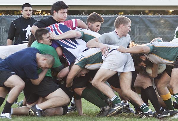 sac state mens rugby:The men?s rugby team participates in a scrum during a practice.:Ashley Neal - State Hornet