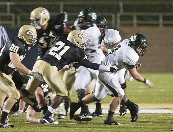 Sac State vs. UC Davis Causeway Classic:Aggie?s corner back Marcus North (21) gets a hand on Hornets running back Jake Croxdale (8) during the Causeway Classic Saturday at UC Davis. The Aggies beat the Hornets 17-16.:Robert Linggi - State Hornet