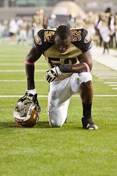 Sacramento Mountain Lions, Sac State:MoLos linebacker Prince
Kwateng kneels before an Oct. 15 game against the Las Vegas
Locomotives. :File Photo
