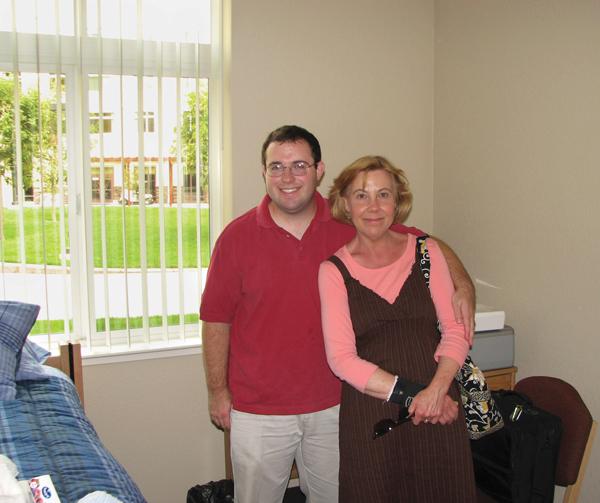 Scott Hawkins :Scott Hawkins poses with his mother Elizabeth Hawkins during move-in day at the American River Courtyard residence hall.:Courtesy Photo 