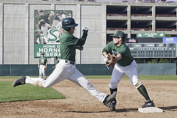 b1:Freshman second baseman David Del Grande gets tagged out during a practice. :File Photo