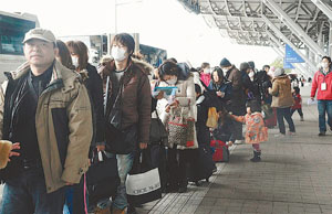 Going home Japan::Photo courtesy of McClatchy Tribune