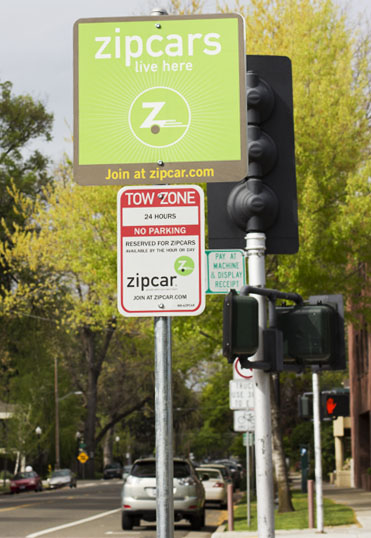 Zip Car is a self service “car share” company, which allows licensed drivers to rent cars on an hourly or daily basis. Each Zip Car location is marked by Zip Car parking signs.
