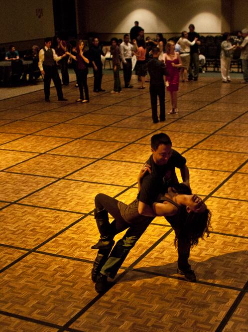 Dancers at Salsa Loca’s live music and dance concert on Thursday night perform a dip on the wooden dancefloor.
