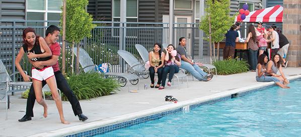 Daniel Fernandez tosses Vanessa Segura into the pool at the Upper East side lofts student housing.  Thursday Upper East Side lofts threw a party where these two horsed around.  Daniel is a criminal justice major and Vanessa is a psychology major while both are juniors.  