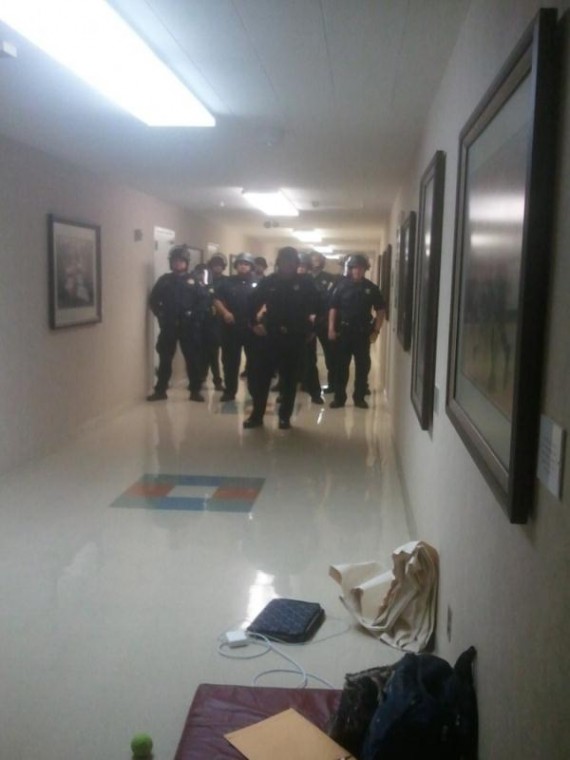 Police in riot gear at Sacramento Hall:Police in riot gear stand in Sacramento Hall in preparation of removing students.:Courtesy of sit-in organizers