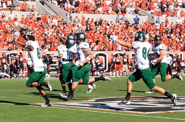 
Sacramento State football players storm the field at Reser
Stadium on Saturday after their historic 29-28 overtime victory
against Oregon State.
