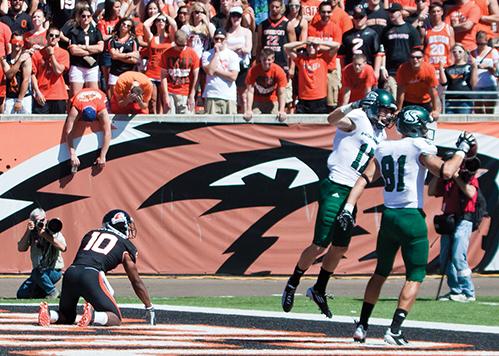 
Wide receivers Chase Deadder, right, and John Hendershott,
left, celebrate after

Deadder catches a TD pass in the second quarter against
Oregon State on Saturday.
