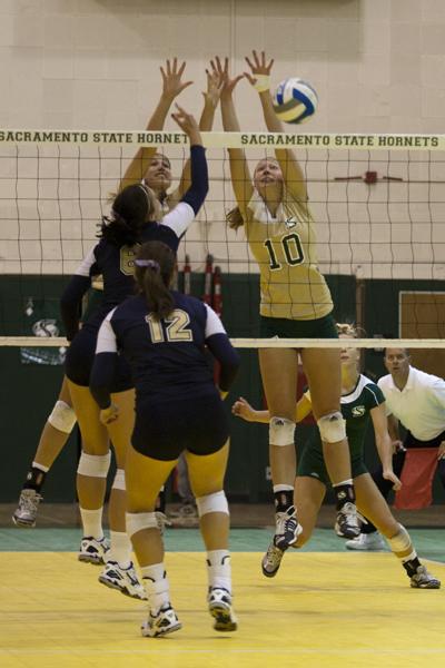 Hornets outside hitter No. 10 Eryn Kirby, senior, and teammate
attempt to block the Northern Colorado attack.
