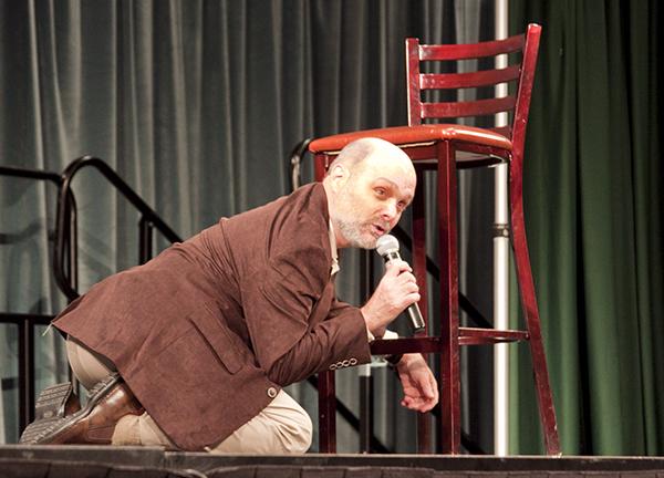 Joe Raiola, senior editor at MAD magazine, mocks the absurdity
“duck and cover” drills he practiced as a child during his lecture
“The Joys of Censorship” in the University Union on Thursday.
