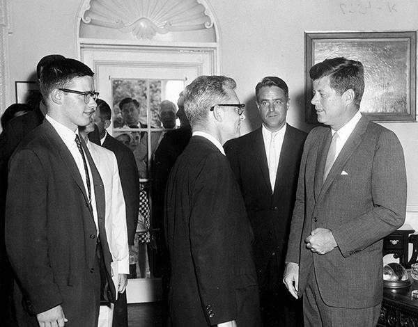 Retired Sac
State physics professor Michael Shea, left, waits to greet
President John F. Kennedy during the historic White House Rose
Garden ceremony on Aug. 30, 1961. It was held to honor the first
Peace Corps
volunteers.

 
