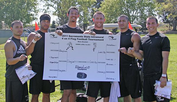 Team Ebony Lust pose after winning Sac States 4-on-4 flag
football tournament.
