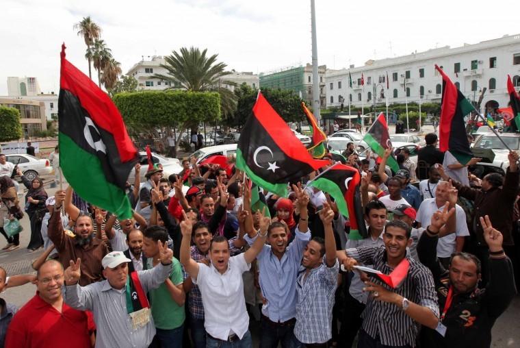 Libyans celebrate on the streets after the death of Moammar
Gadhafi.

