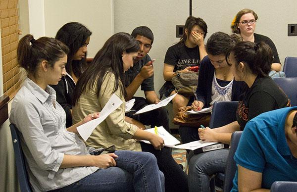 Group of audience members working on a case study during the
human trafficking presentation by Open Doors Inc. The meeting took
place Thursday in the Walnut Room of the University Union. 
