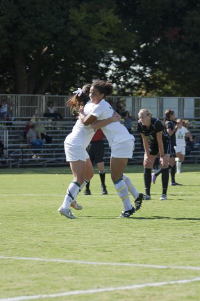 Jordyn Rolling, sophomore communications major with an emphasis
on public relations, celebrates with her teammate after scoring the
second goal for Sacramento State.
