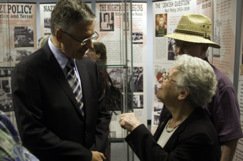 Denis Doute, CEO of the Societe Nationale des Chemins de francais,
and Holocaust survivor Liz Igra have a conversation within the
exhibit shortly after the gallery's ceremonial opening on Sept.
20.
