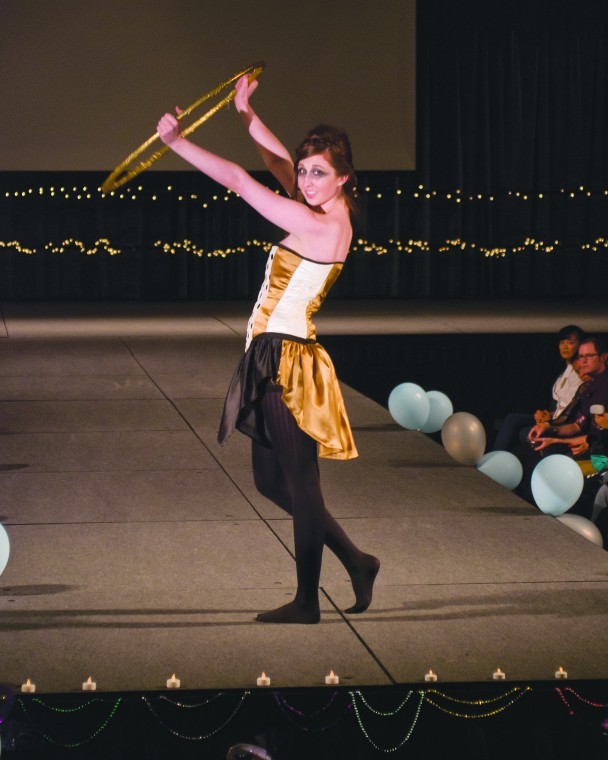 One of the models in the Student Fashion Association charity
fashion show held up a gold hoop on the runway.

