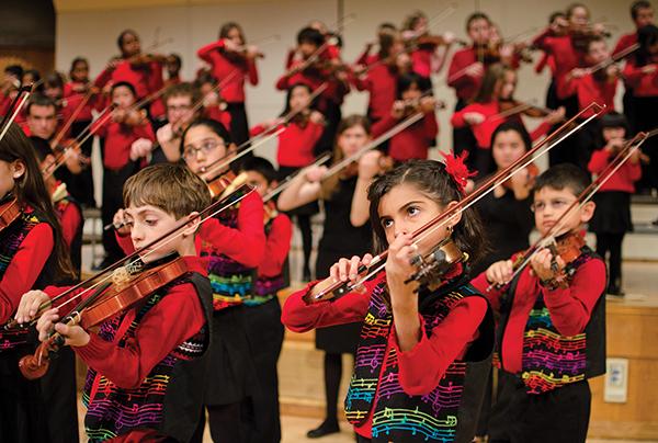 The children who are part of Sacramento States String Project
rehearse on Monday night. The String Project serves as a music
education program for underprivileged, local schools.
