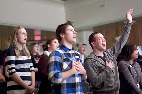 Senior English major Lydia Huesemann (left), sophomore
kinesiology major and German exchange student Brett Shoemaker
(center) and senior English and communications major Christopher
Olvera (right) all pray together at the first CRU meeting on
Wednesday night in the University Union.
