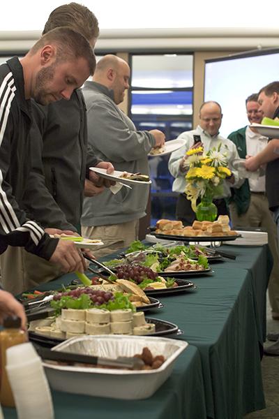 Sacramento State booster members and the football staff gather
to enjoy food and drinks in the Alumni Center on Wednesday,
footballs signing day.
