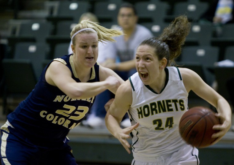 Sacramento State junior forward Kylie Kuhns tries to drive past
Northern Colorado sophomore forward Kim Lockridge during Fridays
game at the Nest.
