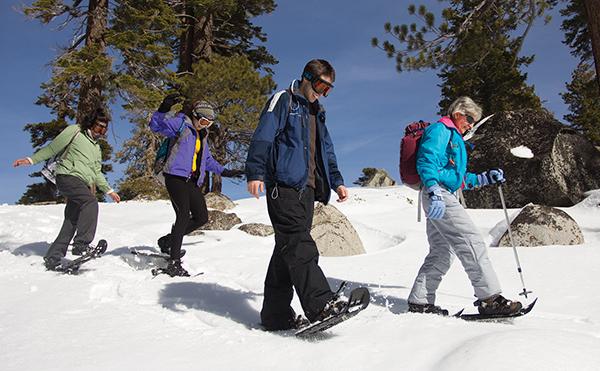 Sac State students and alumni trek through the snow at Echo
Summit during Peak Adventures snowshoeing trip.
