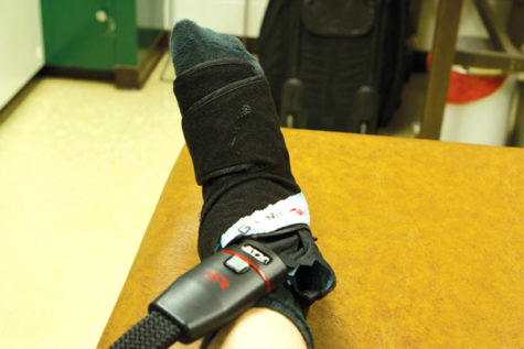 Junior Jordan Estrada of the Sacramento State men's basketball
team uses a device called Game Ready to recover from a high ankle
sprain he suffered on Dec. 31 against the Weber State University
Wildcats.