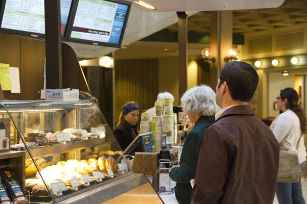 People line up to buy their morning coffee from a Java City stand in the University Union. 
